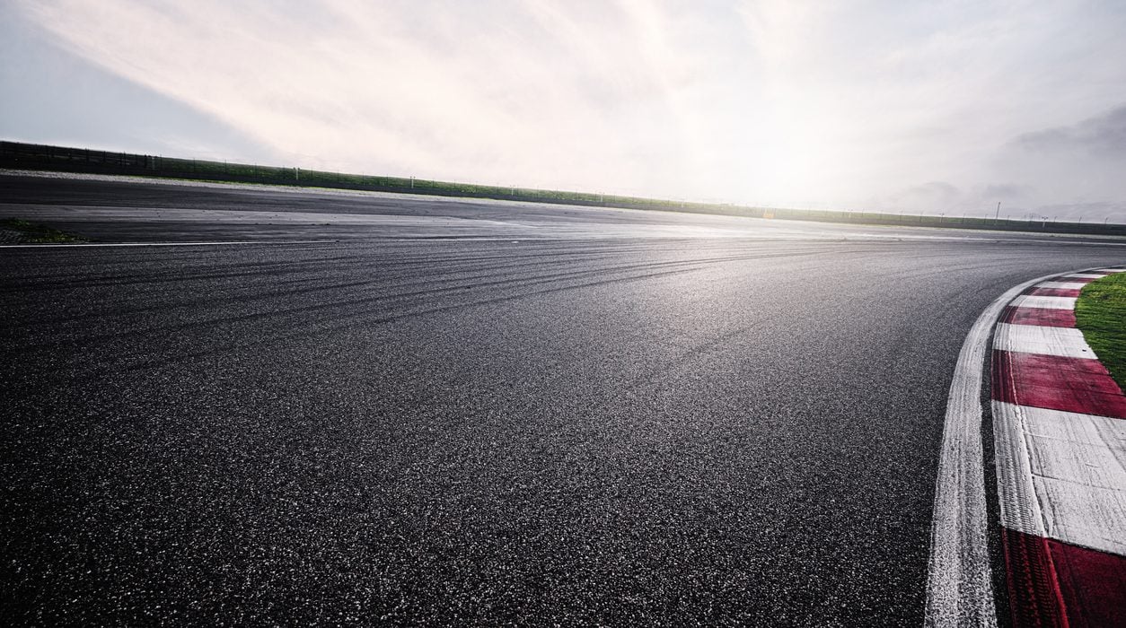 Empty Racing Track With Sunlight